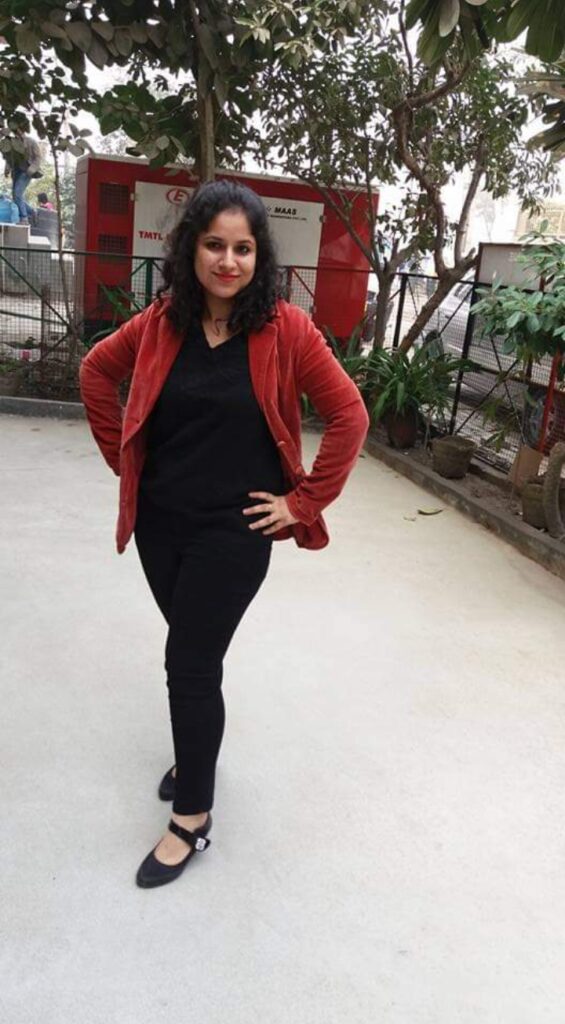 Smiling young woman wearing stylish branded outfit bought with her first salary, feeling proud and confident.