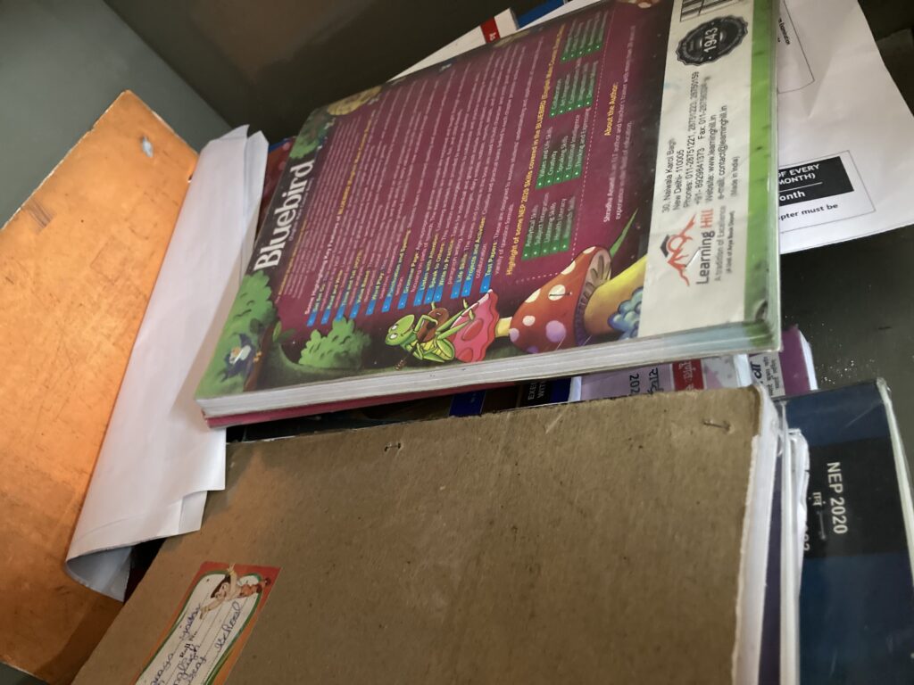 A pile of old notebooks and coaching notes kept even after completing a degree, saved with the thought of possibly teaching someone in the future.