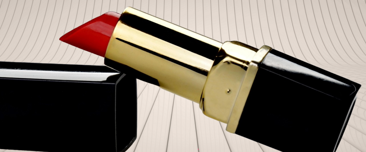 Lipstick with an open cap placed slantly, symbolizing quiet success stories built on purpose, confidence, and simple living.