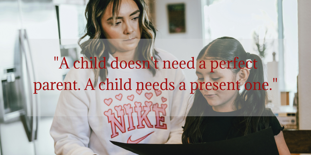 A mother kneeling beside her young daughter, sharing a warm and tender moment together, with the quote "A child doesn't need a perfect parent. A child needs a present one."