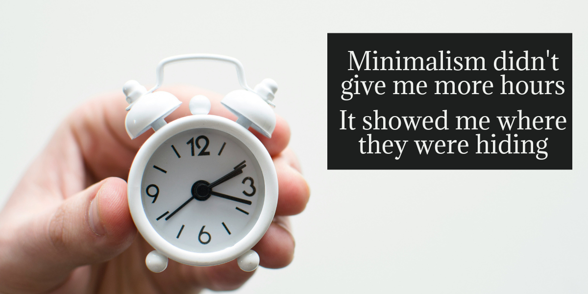 Hand holding a white alarm clock with a quote about minimalism and finding more time through intentional living.