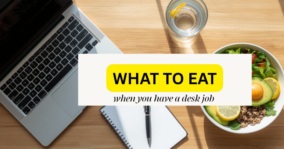A minimalist wooden office desk with a laptop, a healthy meal bowl, and a glass of water, representing healthy eating habits for a desk job.